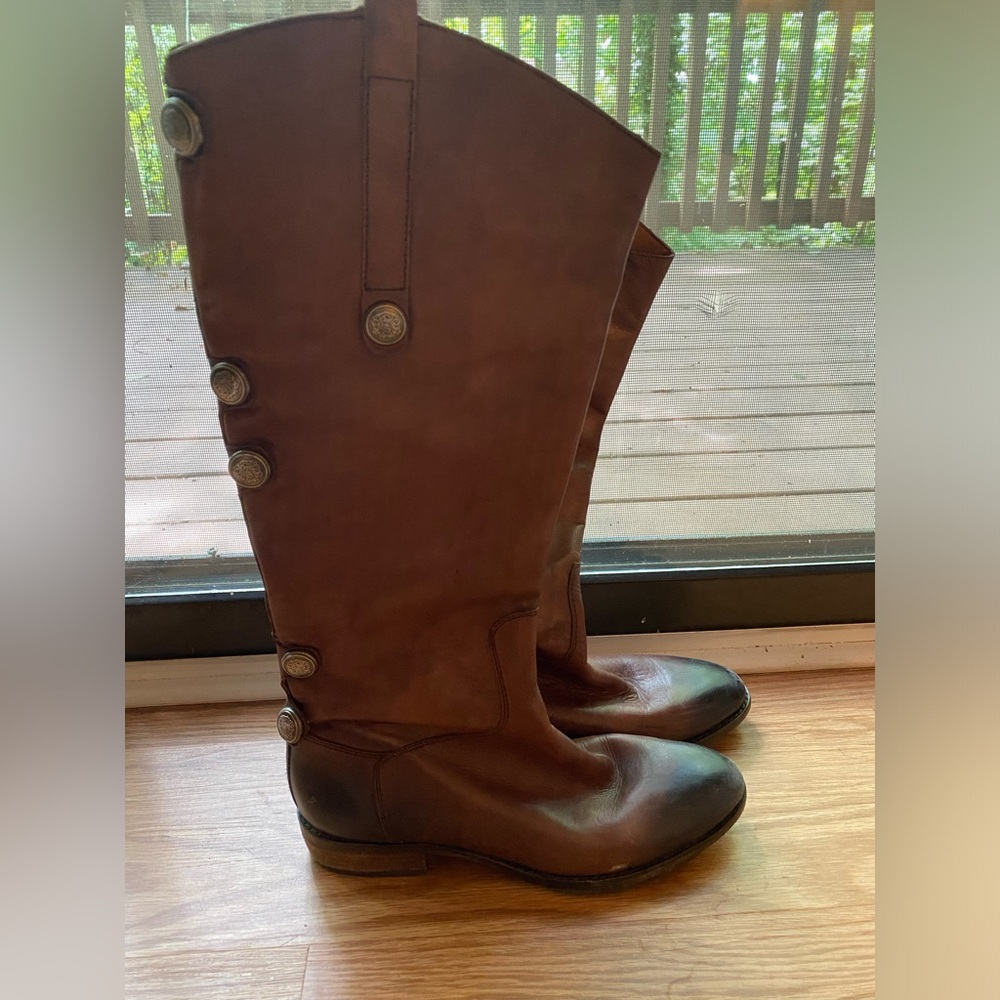 Brown riding boots.